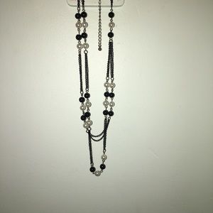 long necklace with black and white pearls